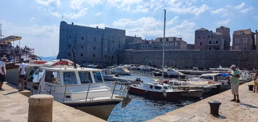 Old Town Dubrovnik port with ferry boats arriving from Cavtat.