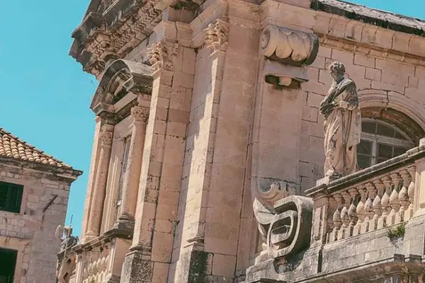 Detail of Baroque stone statues and ornaments on Dubrovnik Cathedral.