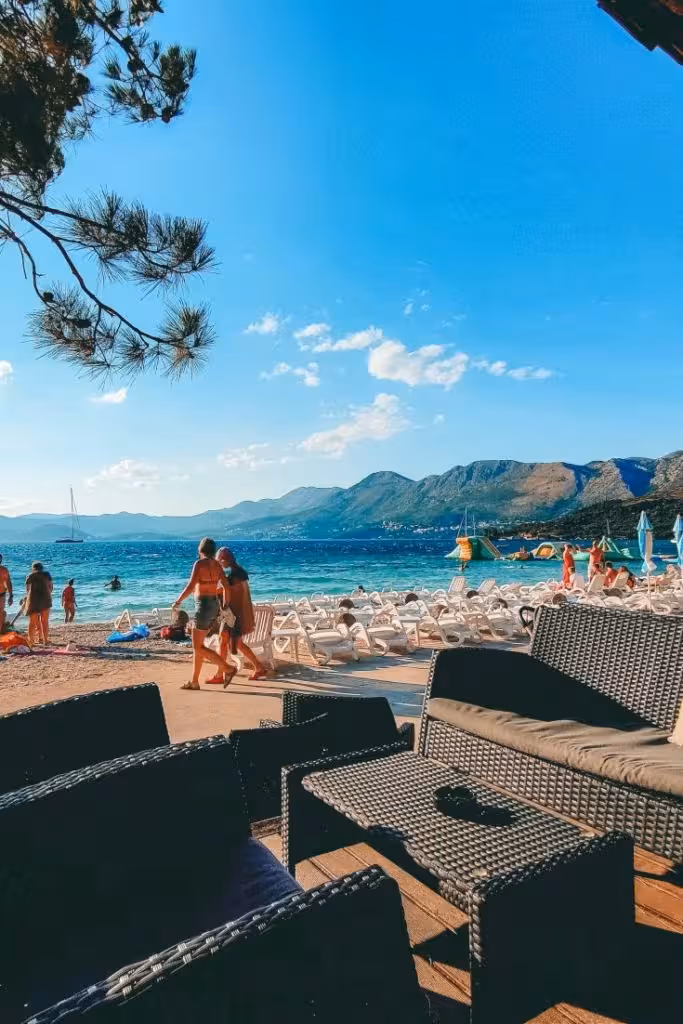TCavtat Žal Beach walkway and sunbathers