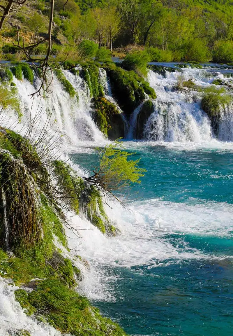 Zrmanja River canyon with whitewater and karst waterfalls.