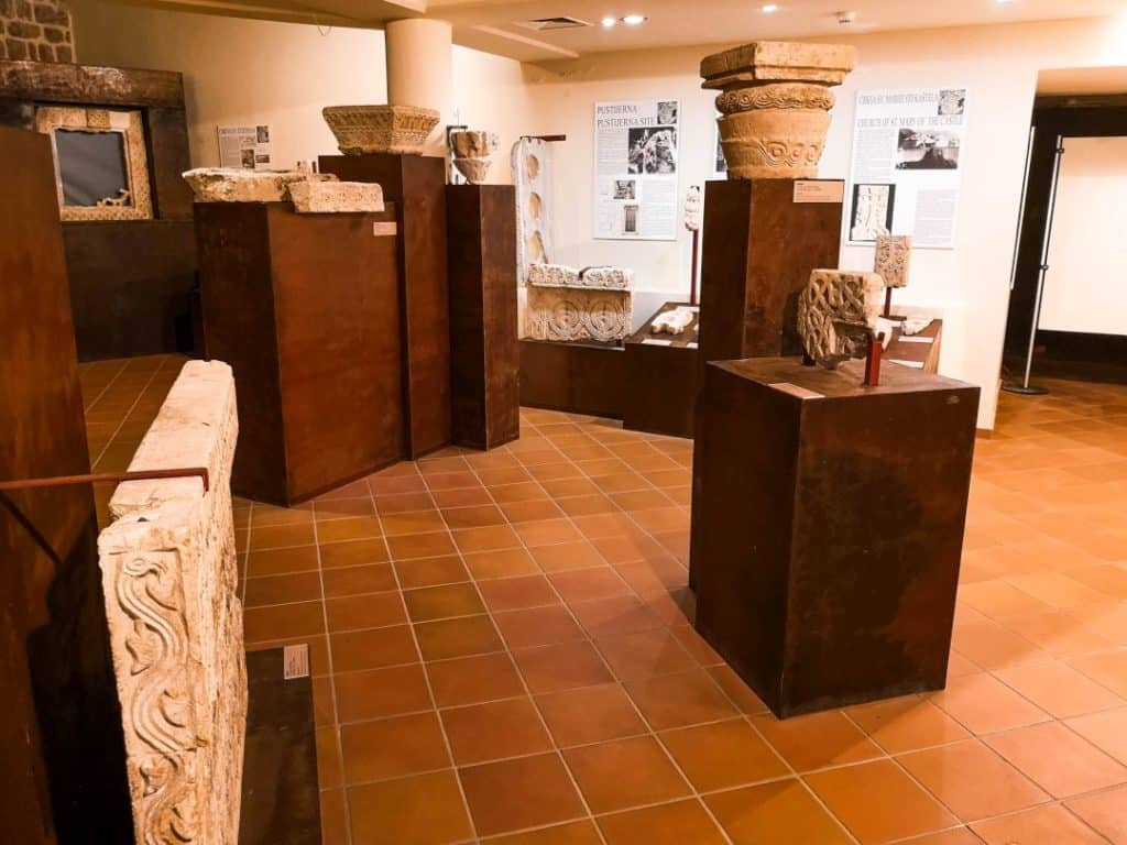 Carved stone fragments and early medieval pieces on display.