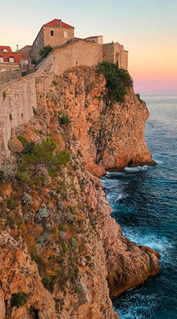 Visitors walking along the Dubrovnik City Walls ramparts.