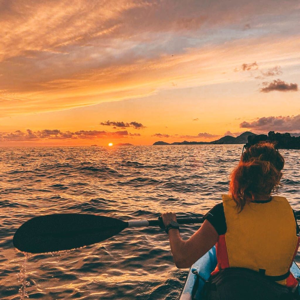 Kayaks on the Adriatic at sunset between Lokrum and Dubrovnik.