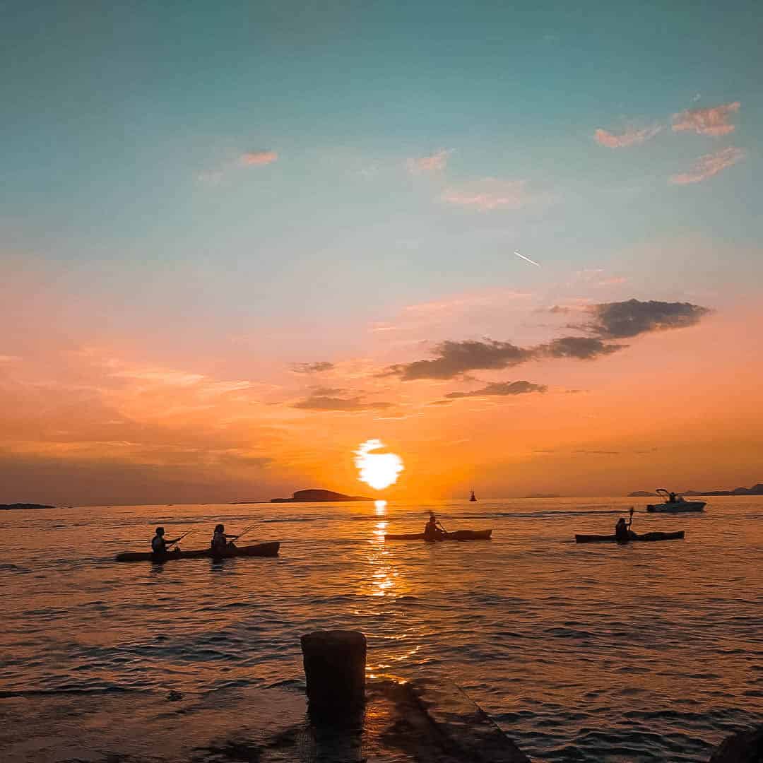 Sea kayaks near Dubrovnik Old Town with Lokrum Island in the distance.