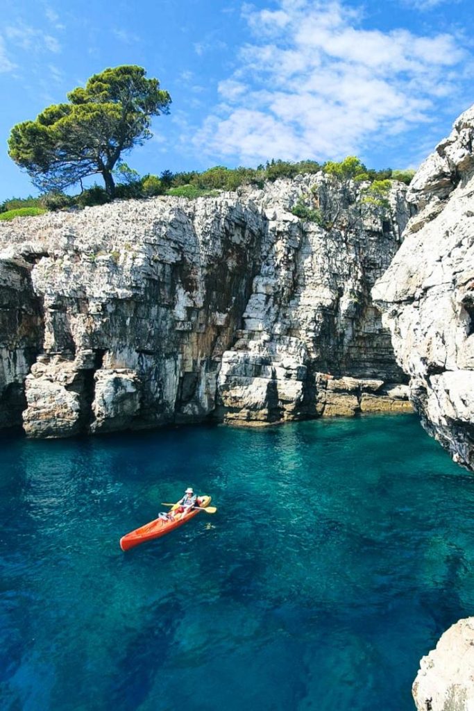 Kayaks at the entrance of Pigeon Cave on Lokrum Island.