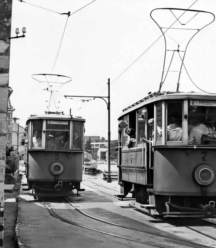Black and white photo of old trams