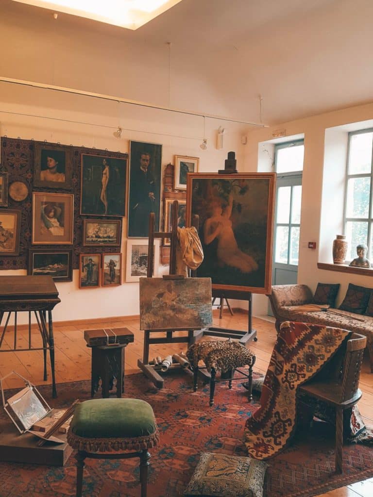 A beautiful photo of paintings and other items displayed in the gallery of Vlaho Bukovac House.