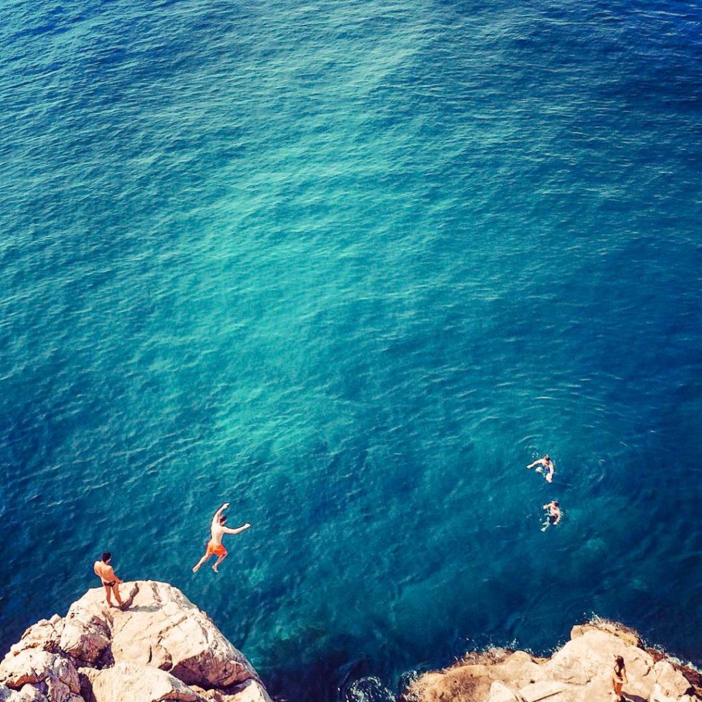 Now, imagine being mesmerized by the sun reflection of the inviting cool water from a rock. Then, hurling yourself into the deep blue and finally surfacing, floating on your back while enjoying the beauty of Croatia.