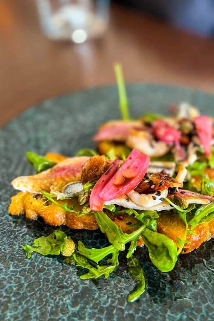 Fish Steak with decorations on a plate served at local konoba