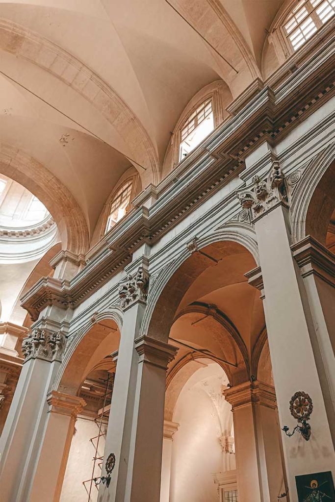 Interior look at the vaults and arches supporting tall ceiling of the Cathedral