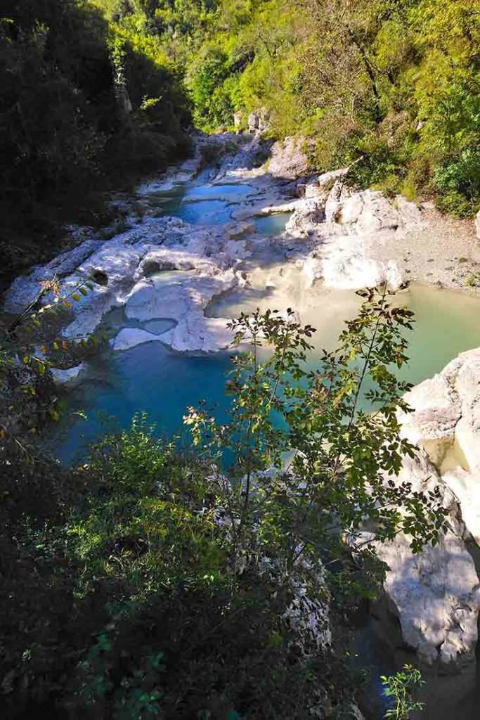 Kotli is a waterfall with limestone pools of emerald-greenish water.
