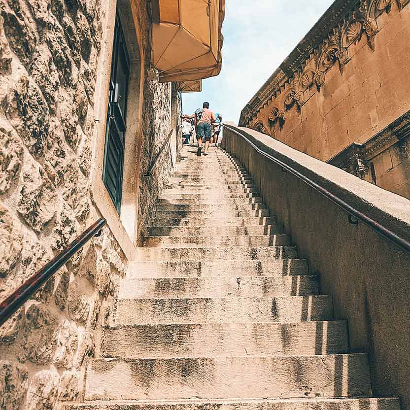 Main Gate Pile has the longest flight of stairs that get you up to the walls. At least a hundred.