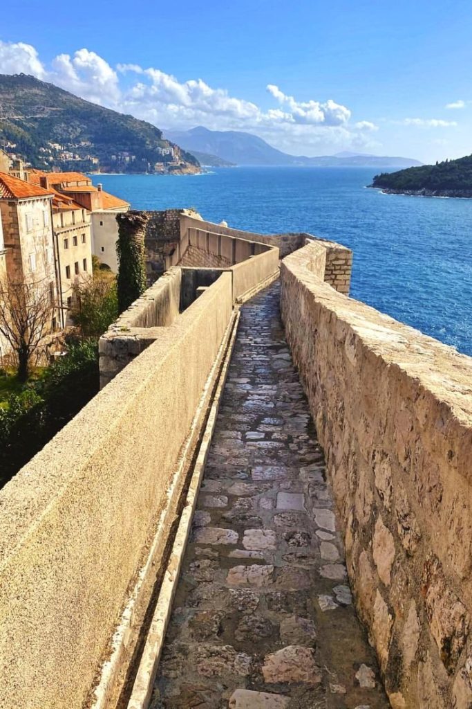 Narrow path along the walls that can fit one to two people at a time lead towards the Bastion Holy Marguerite