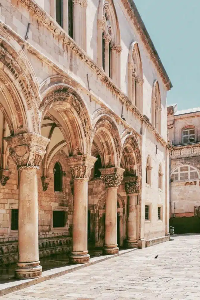 View of ornamented arches and pillars of Rector's Palace gate from Stradun street