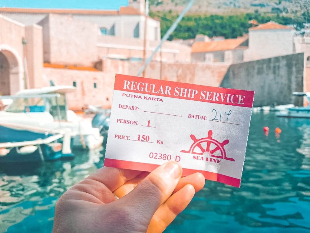Hand holding a Sea Line Ticket for Cavtat to Dubrovnik ferry