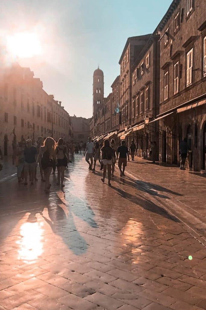 walking with crowd along Stradun in the afternoon