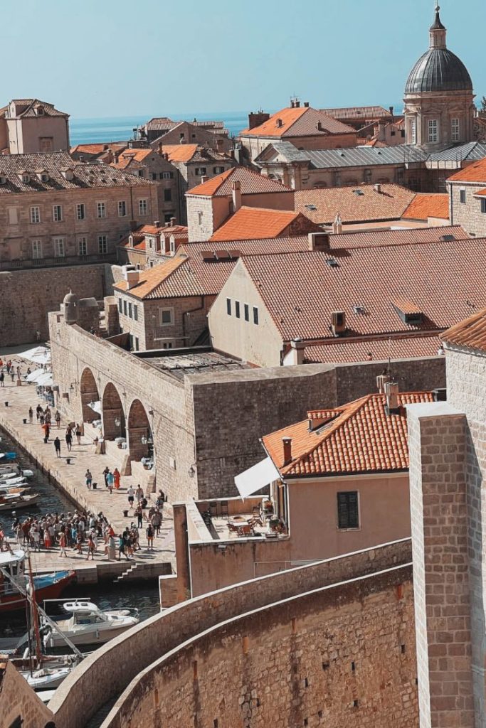 Views from the northern side of the City Walls, looking down on Old Port and people promenading