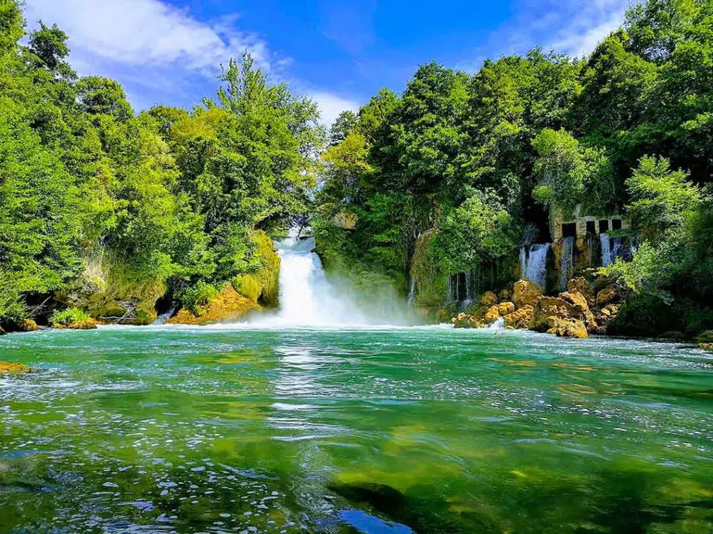 Bilušića buk is a 100 m wide travertine waterfalls along the Krka River.