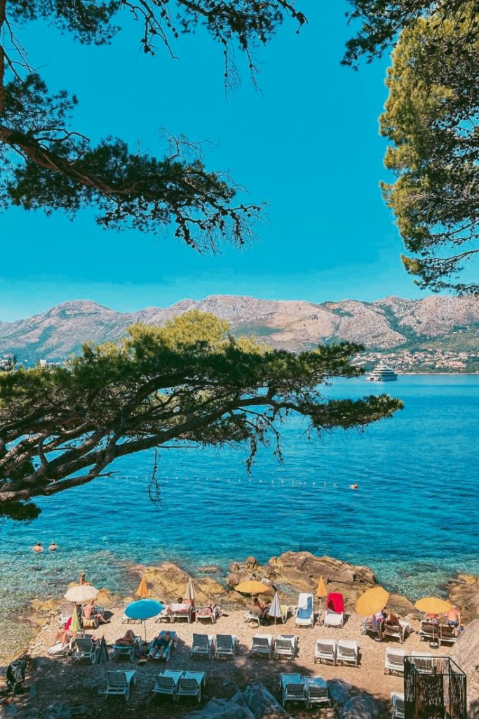 ključice are a small pebble beach with shade from pine trees